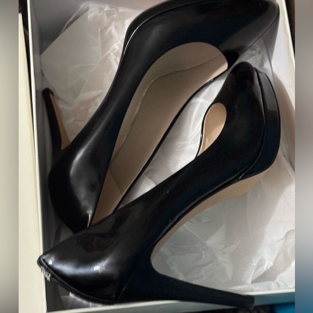Patent leather black Coach platform heels